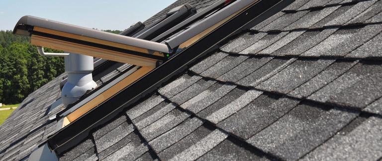 How Does Proper Roof Flashing Prevent Water Damage Around Chimneys and Skylights