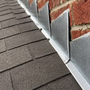 How To Properly Install Step Flashing Along Roof-to-Wall Transitions